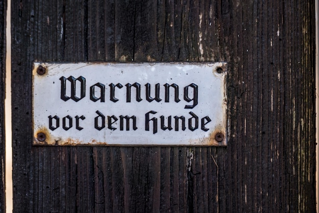 Close-up of text on wooden door