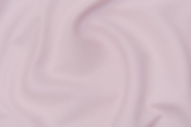 Текстура крупным планом из натуральной красной, розовой или оранжевой ткани или ткани того же цвета. Фактура ткани из натурального хлопка, шелка или шерсти или льняного текстильного материала. Красный и оранжевый фон холст.