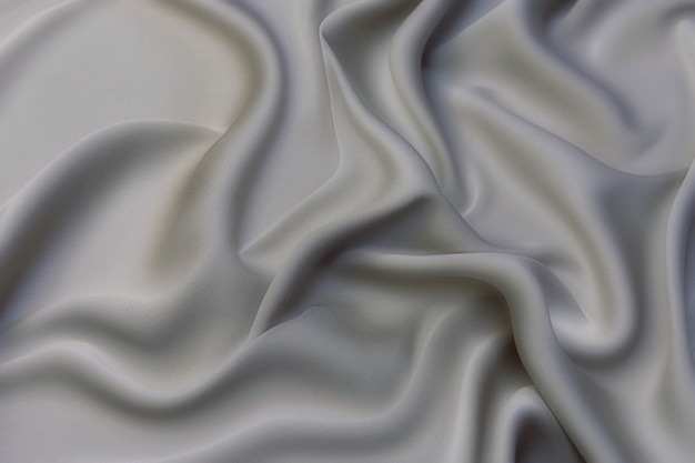 Текстура крупным планом из натуральной серой ткани или ткани серого цвета.  фактура ткани из натурального хлопкового или льняного текстильного материала.  серый фон холста. | Премиум Фото