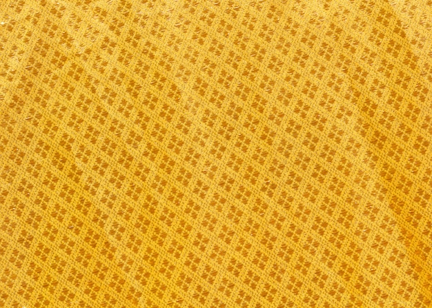 Close up texture of yellow robe