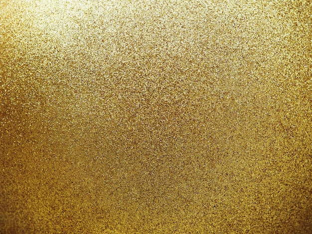 Close up textured of golden round ball with glitter.