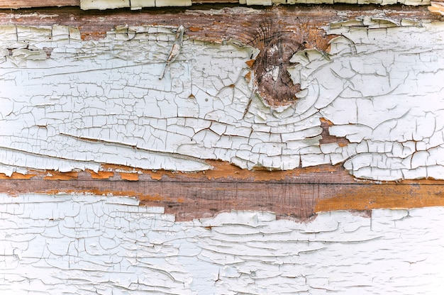 Close-up, textuur van het pellen van witte verf van hout.