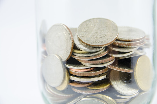 Close up of thai coin in glass bottle on isolated