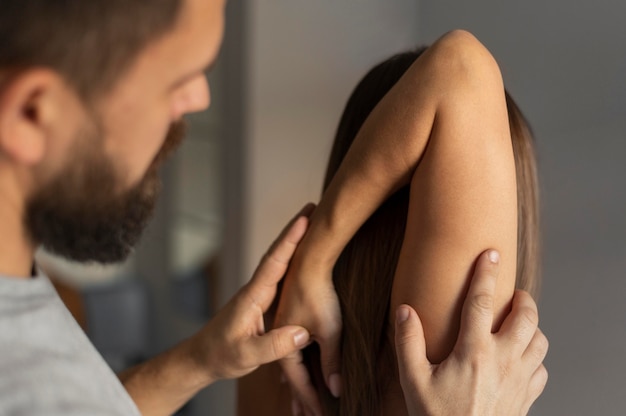 Close-up therapist helping patient