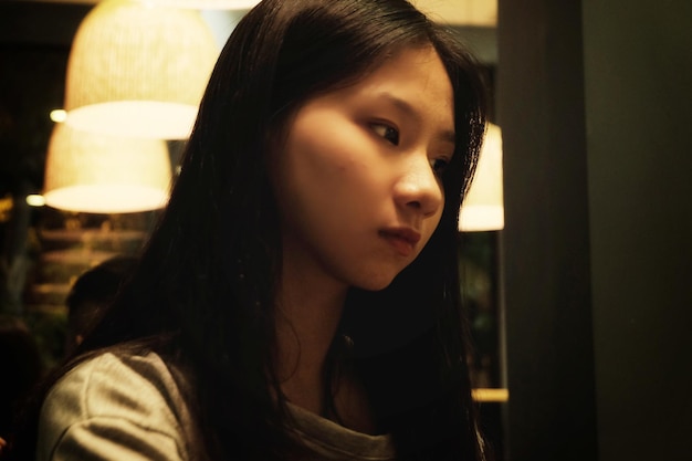 Close-up of thoughtful teenage girl looking away