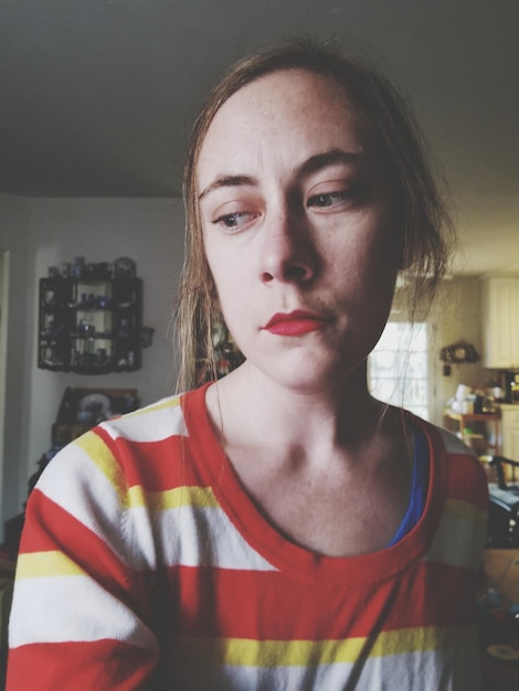 Photo close-up of thoughtful woman standing at home