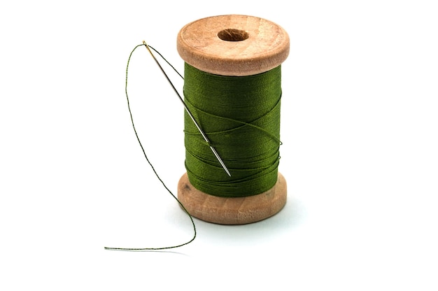 close-up of thread spool against white background