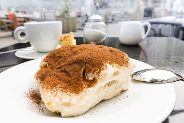 close-up of tiramisu cake served on table