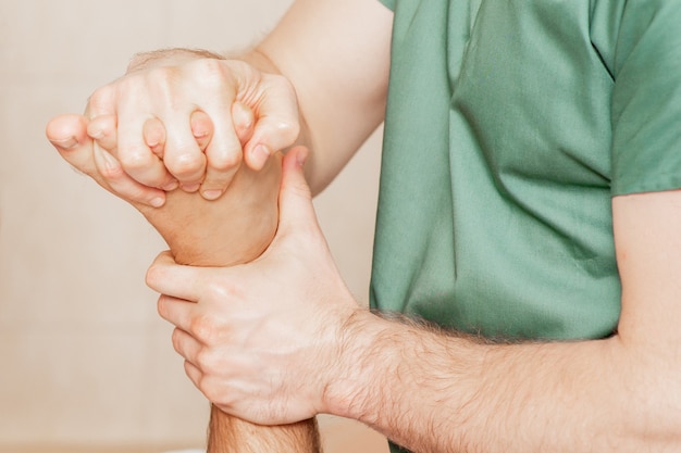 Close up of toes massage of man