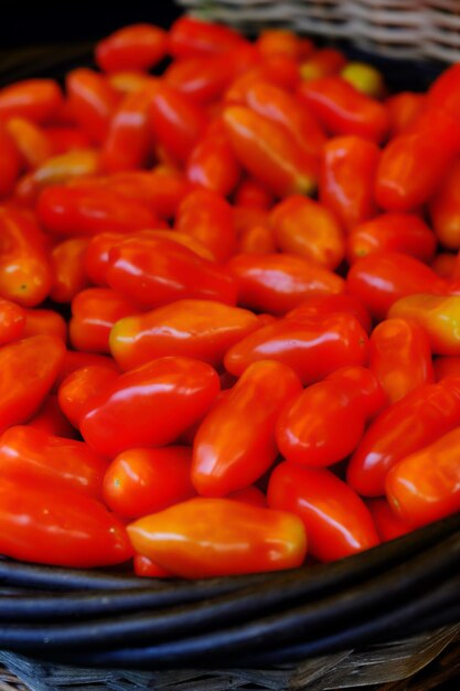 Close-up of tomatoes in basket for sale at market