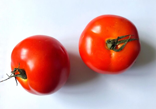 Close-up of tomatoes on white background