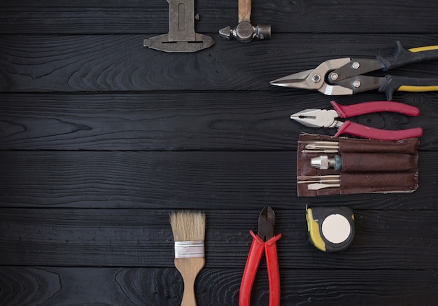 Close up tools on a wooden background