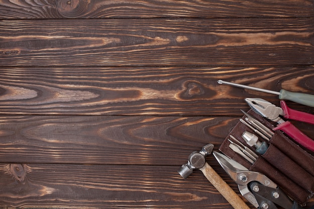 Close up tools on a wooden background