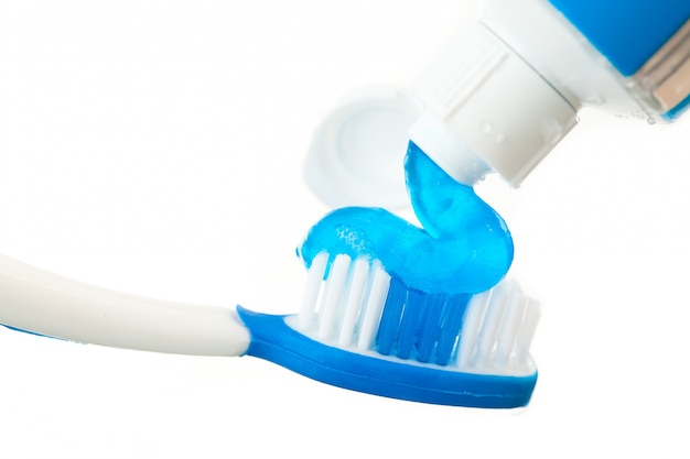 Photo close up of toothpaste on a toothbrush