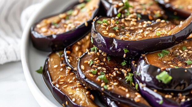 Photo close up and top angle view of seasoned eggplants with sesame seeds on white dish generative ai