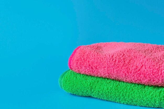 Close-up of towels stack against blue background