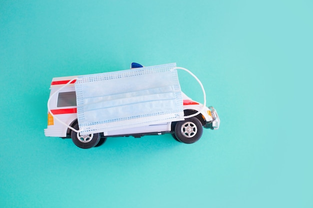 Close up of the toy ambulance on blue background.