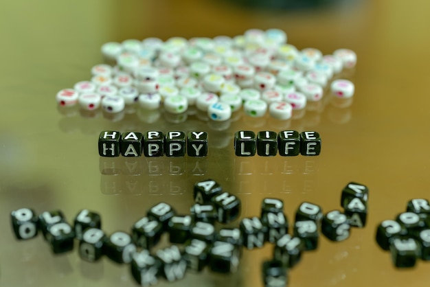 Photo close-up of toy blocks with text on table