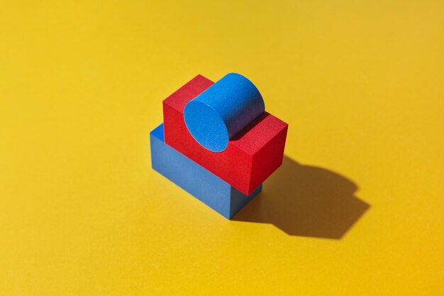 Close-up of toy blocks on yellow background