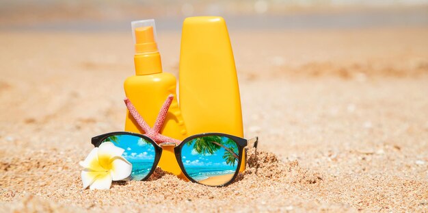 Close-up of toy bottle on sand