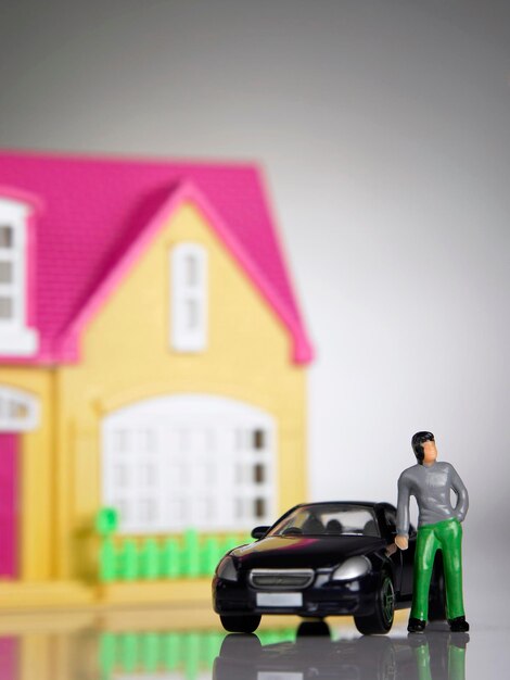 Photo close-up of toy car against toy house