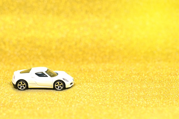 Photo close up of toy car on glitter background with copy space