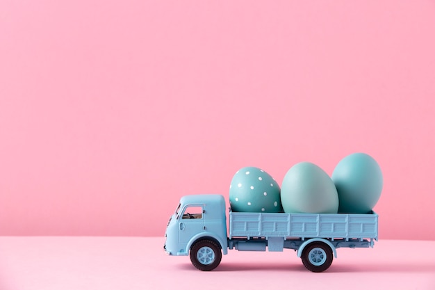 Close up on toy car with easter eggs