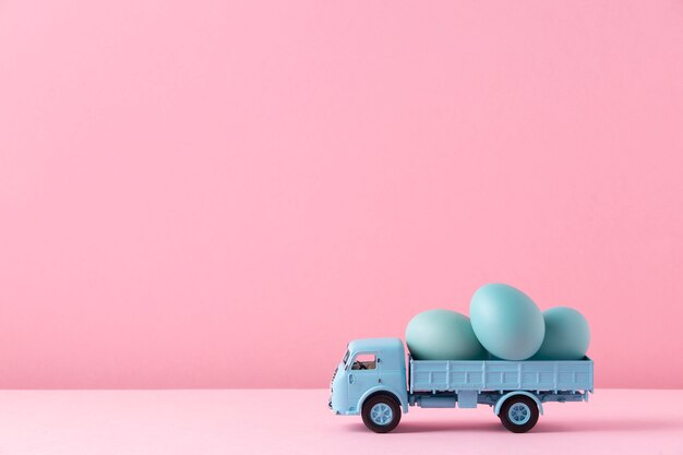 Photo close up on toy car with easter eggs