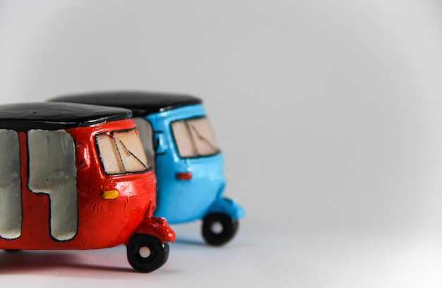 Photo close-up of toy cars against white background