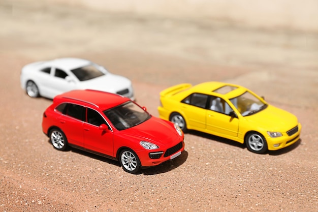 Close up of toy cars on asphalt