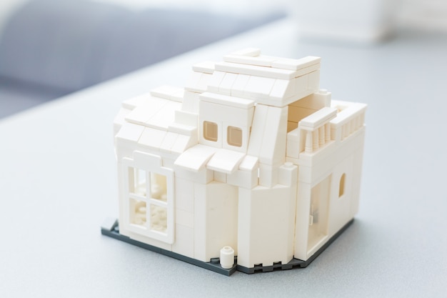 Close-up of toy house model on white background