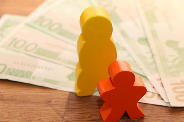 Close-up of toy on paper currencies on table