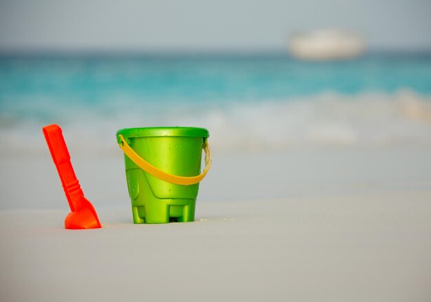 Close-up of toy on table at beach against sky