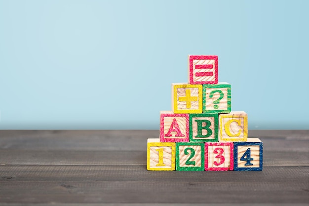 Photo close-up of toys on table against blue background