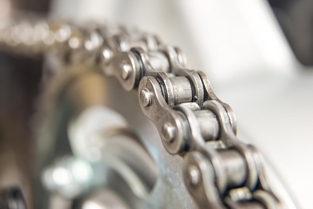 Close up of a transmission chain of a motorcycle mechanical part of a motorcycle