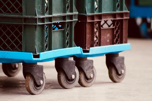 Photo close-up of transport crate on wheels