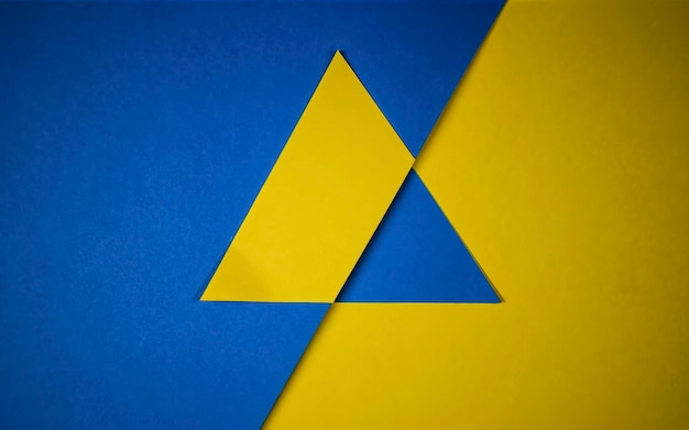 A close up of a triangle on a yellow and blue background