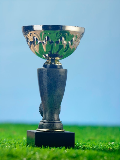 Photo close up trophy on the artificial grass