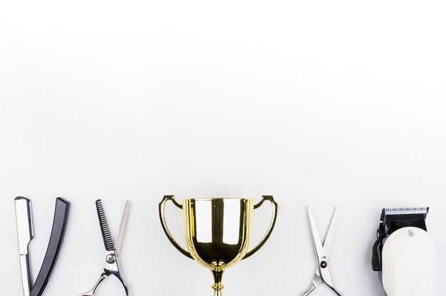 Photo close-up of trophy and equipments against white background