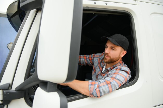 Photo close up of truck driver behind steering wheel copy space