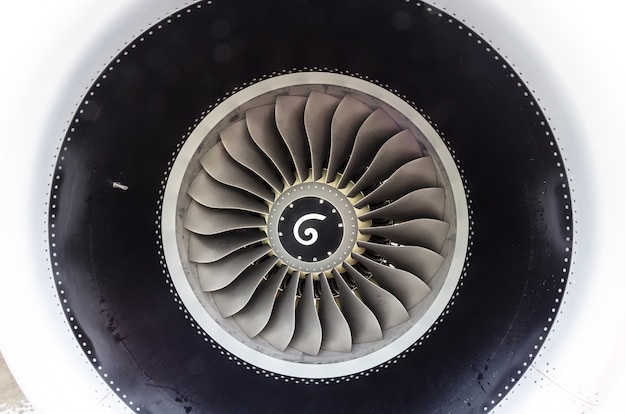 Photo close up of a turbofan jet engine in modern airplane.