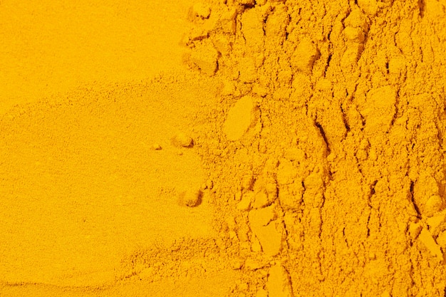 Close up of Turmeric powder texture background