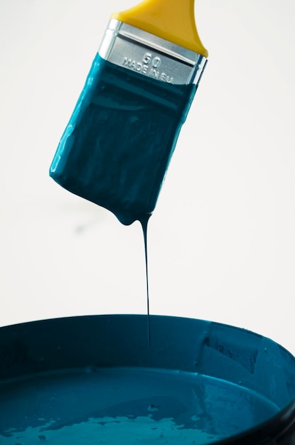 Close-up of turquoise paint in can