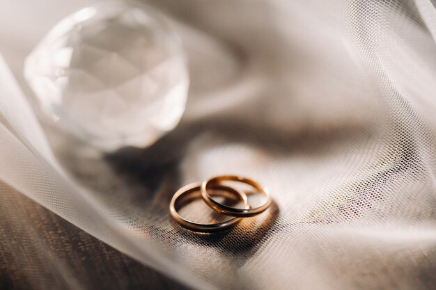 Close-up of two gold wedding rings for a wedding