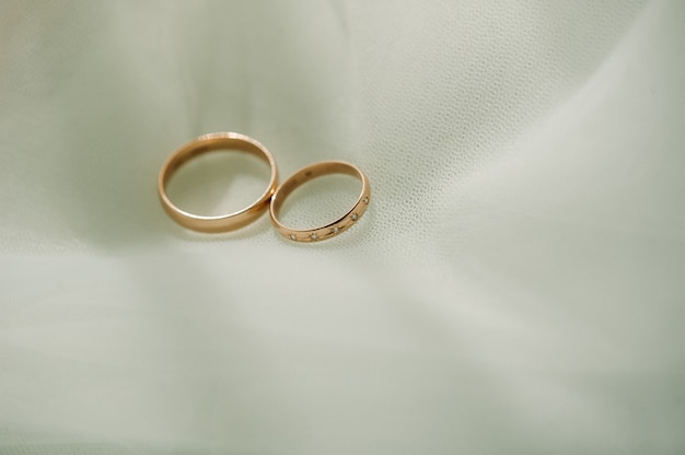 Close-up of two gold wedding rings for a wedding.