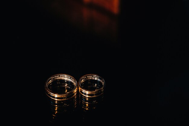 Close-up of two gold wedding rings for a wedding