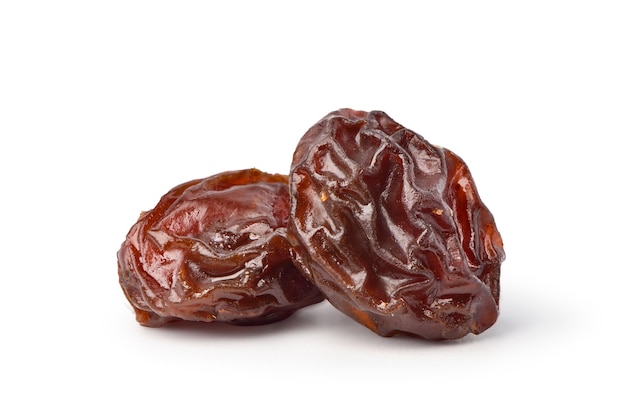 Close-up two Raisins isolated on white background. Clipping path.