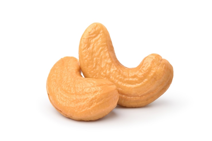 Photo close-up two roasted cashew nuts isolated