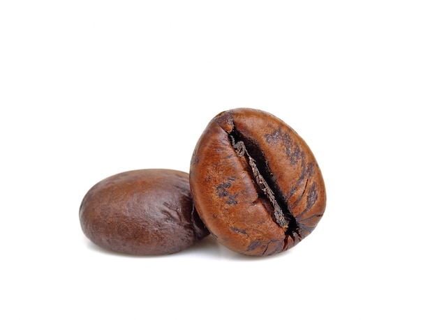 Close up Two roasted coffee beans isolated