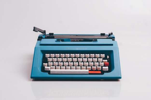 Close up typewriter on white background.